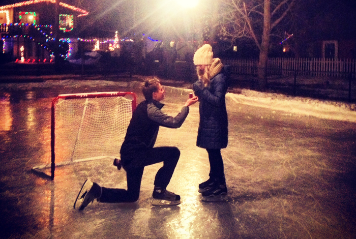 Man proposed marriage to a women on an outdoor ice skating rink.