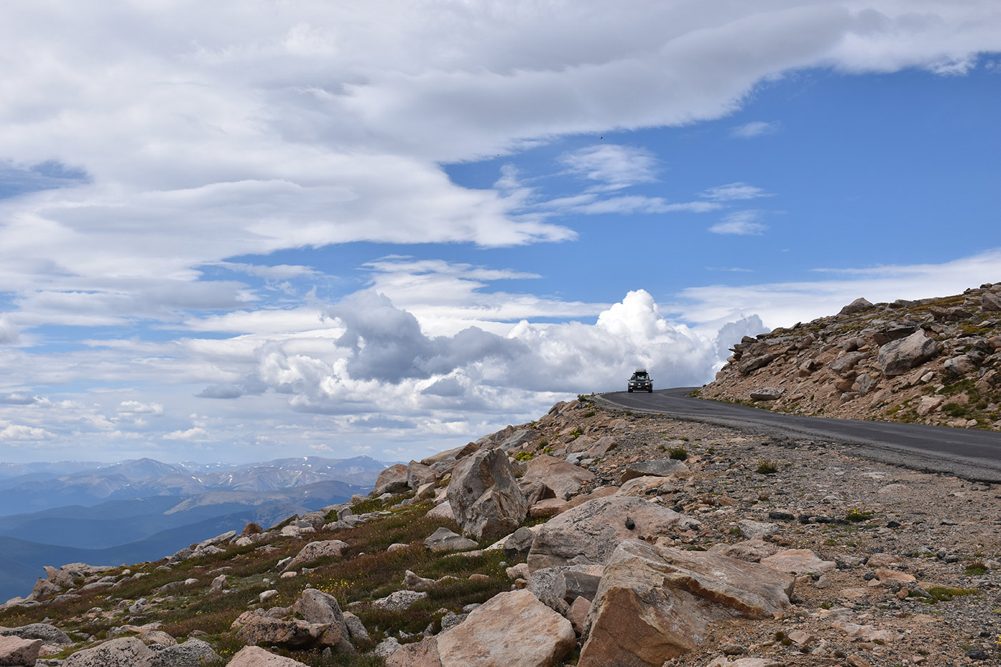 Car driving on highest paved road in North America - Mt Blue Sky