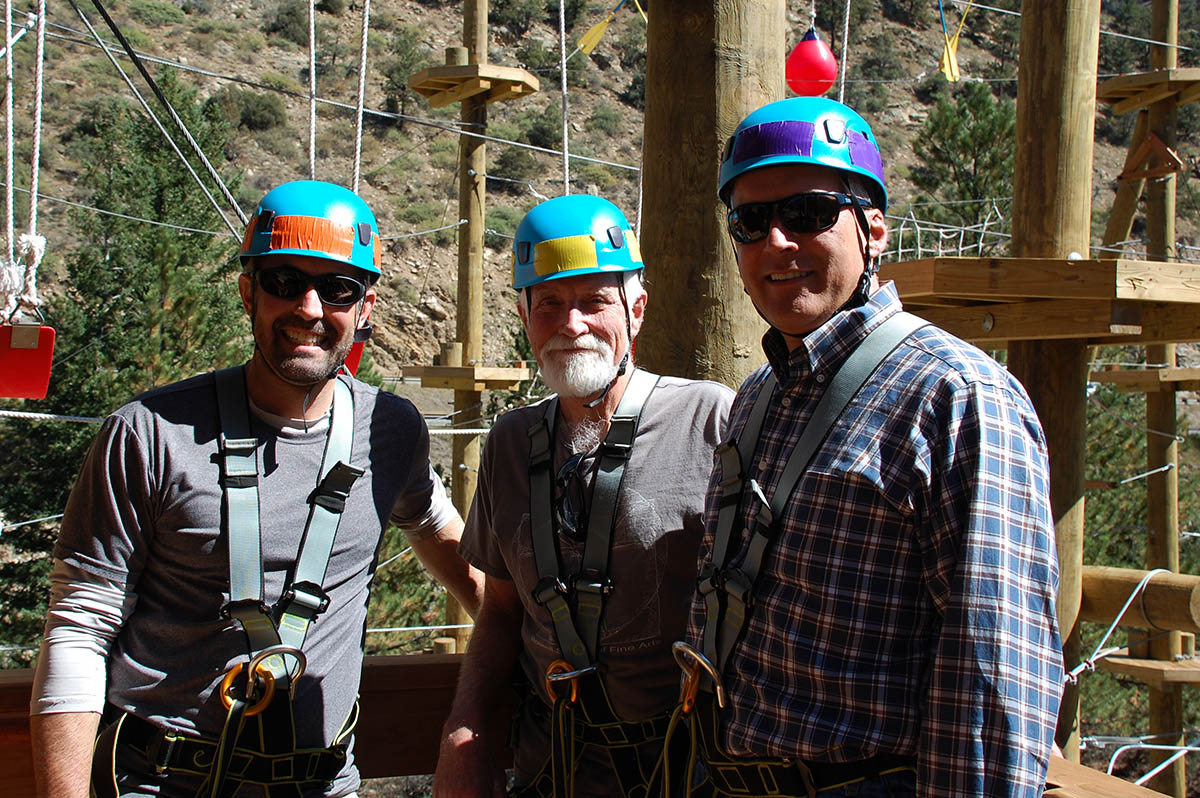 Clear Creek County Commissioners at adventure park wearing blue safety helmets.