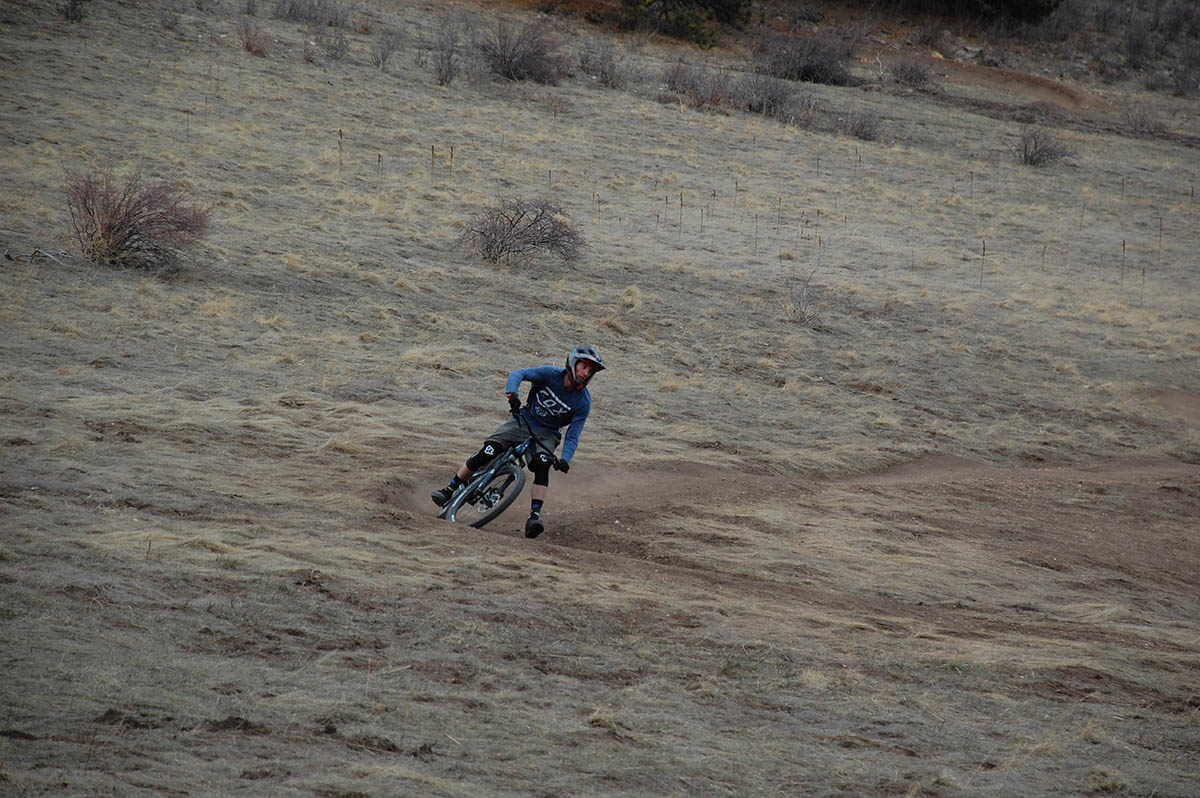 A mountain biker skids around some of the many technical dirt trails available to dedicated cyclists in Clear Creek.