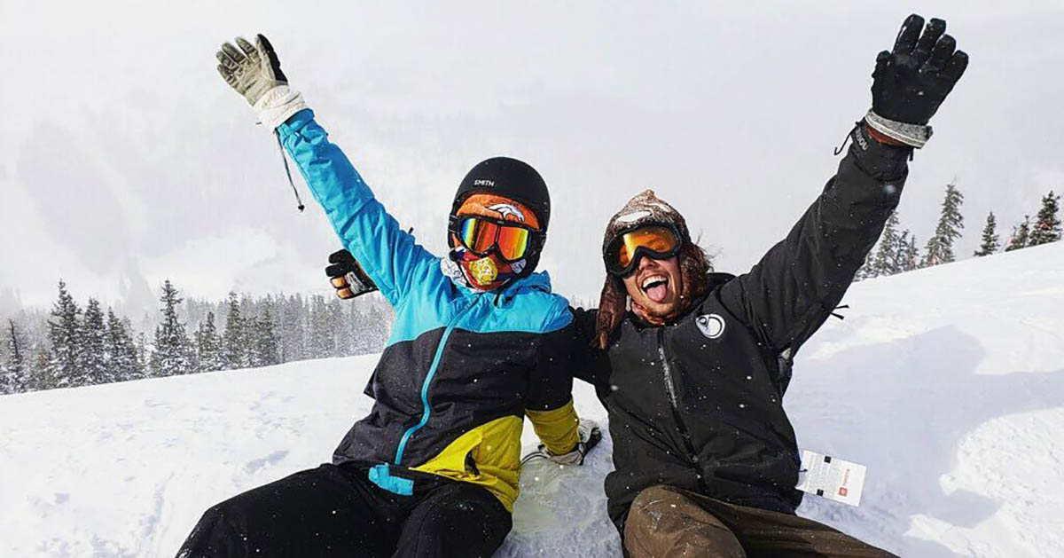 Two friends rejoice after skiing.
